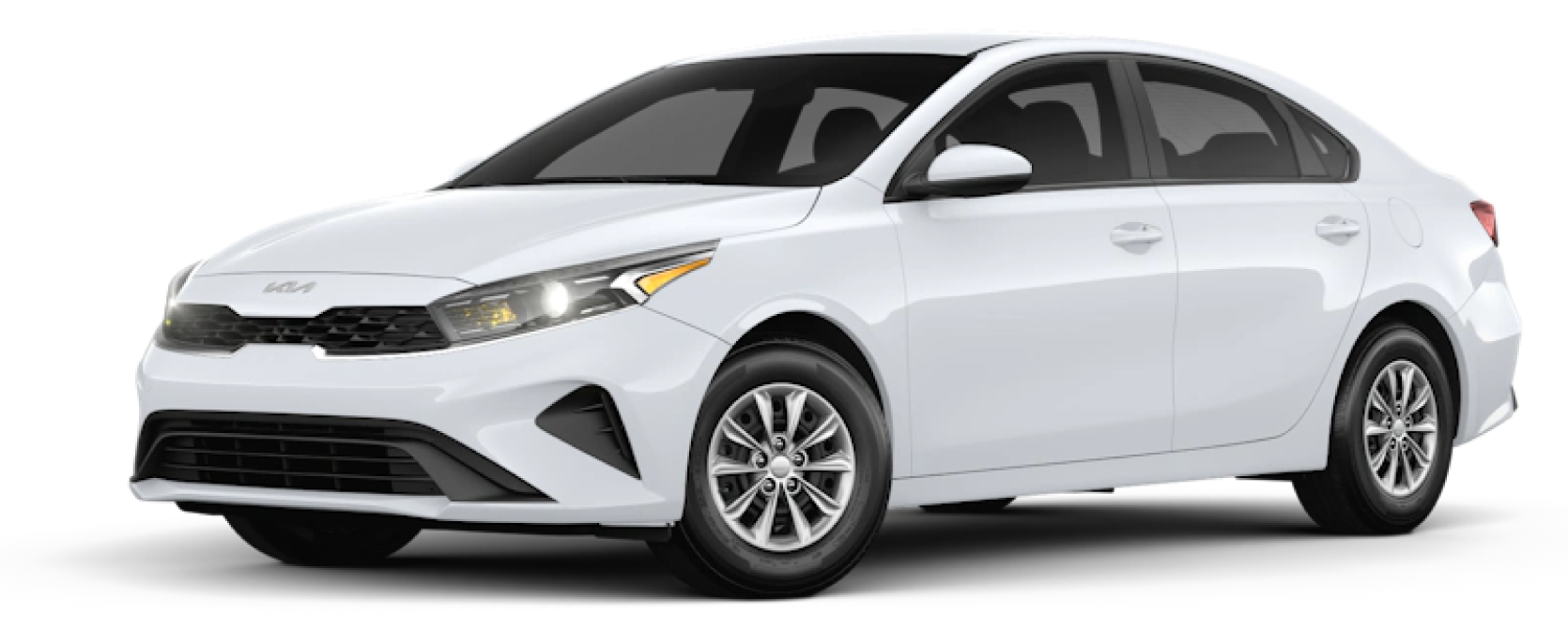 White KIA 4 door sedan front and side view